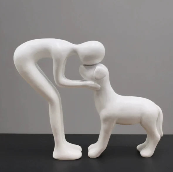 Resin figurine of a puppy and its owner - table ornament interior decoration model.