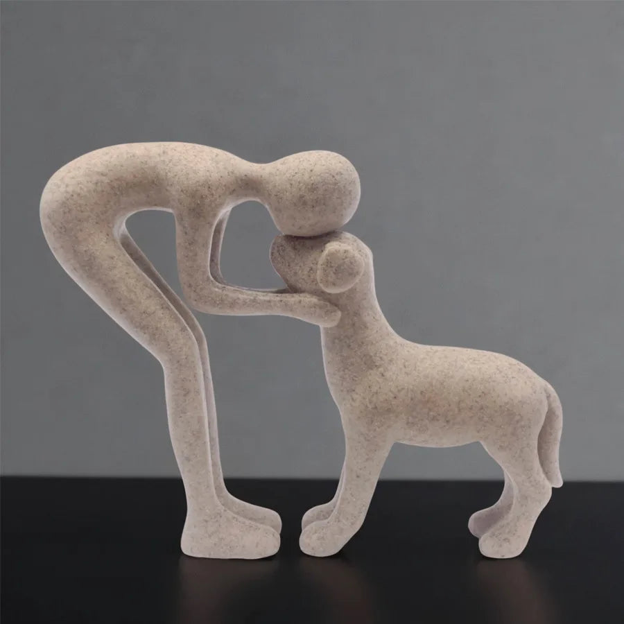 Resin figurine of a puppy and its owner - table ornament interior decoration model.