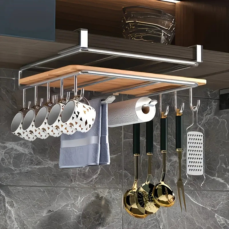 Stainless steel hanging kitchen rack with hooks for paper towels, utensils, and cutting board.