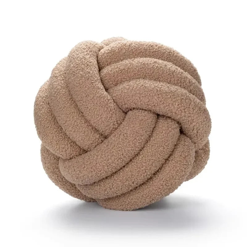 Decorative plush pillow with an aesthetically pleasing globe-shaped knot, ideal for sleeping
