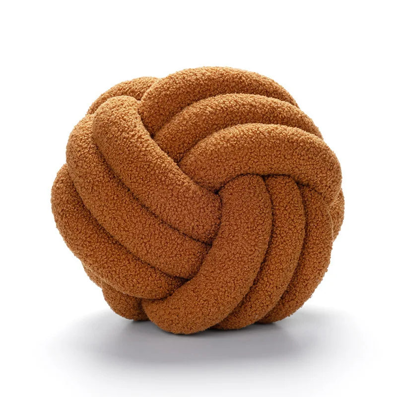 Decorative plush pillow with an aesthetically pleasing globe-shaped knot, ideal for sleeping